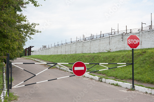 Road signs forbidden, old fence barrier. Quarantine or isolation period concept.