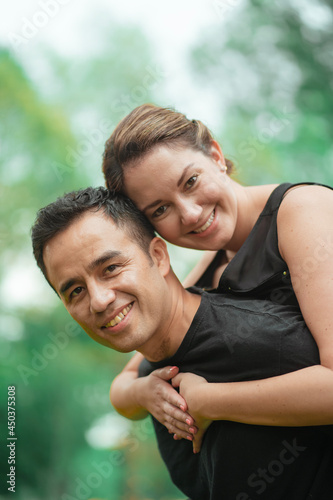 beautiful couple doing piggyback ride