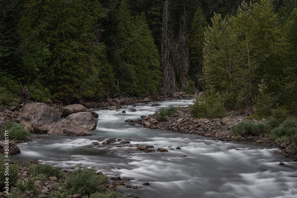 Scenic river flowing through forest in Leavenworth, Washington Scenic river flowing through forest in Leavenworth, Washington