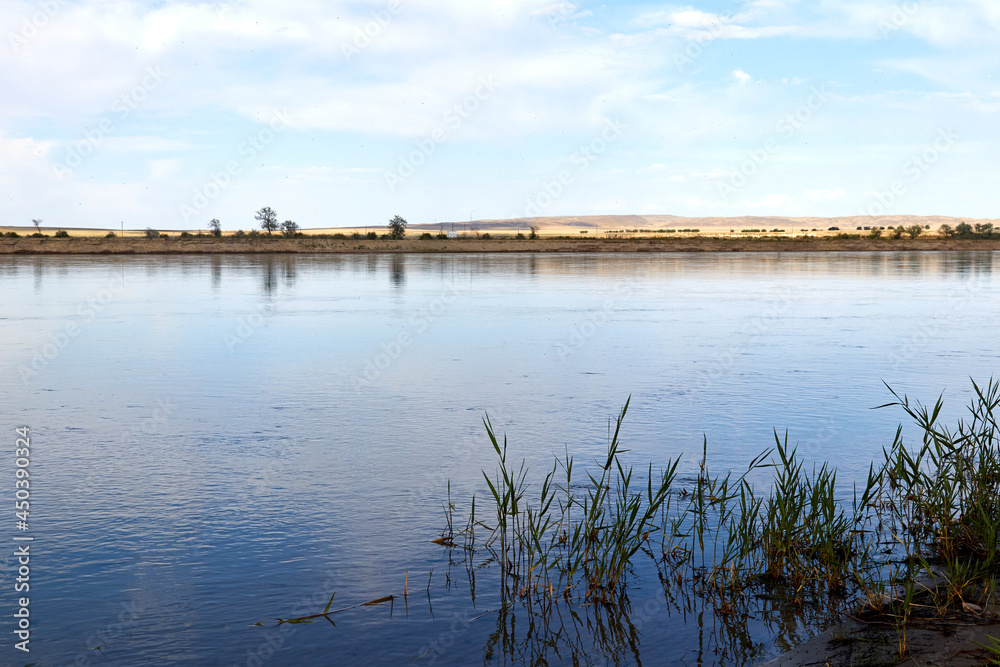 panoramic view of wide steppe river with a calm current