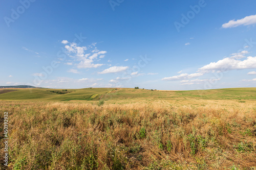 Beautiful wavy landscape of Moravian Tuscany in the Czech Republic. Blue sky and clouds.