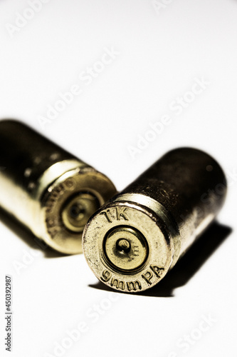 Used cartridge cases on white background.