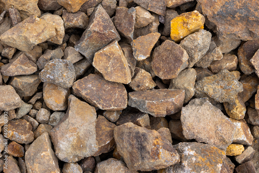 A pile of reddish brown volcanic rock from a previous eruption in Quito, Ecuador