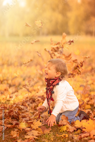 Happy child laughing on autumn walk