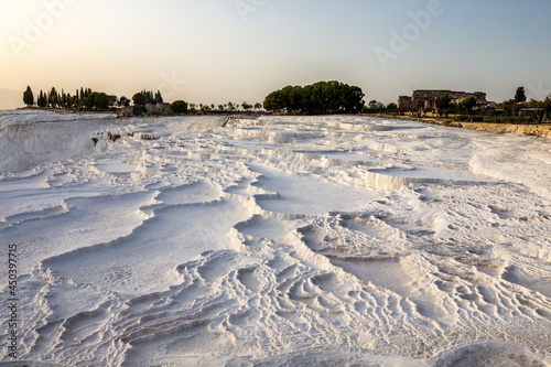 Pamukkale carbonate mineral field at sunset