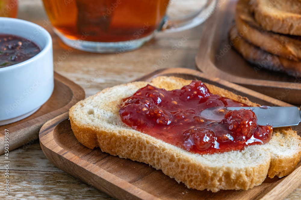 Toasted bread with raspberry jam for easy breakfast. Toasted bread with raspberry jam for easy breakfast.