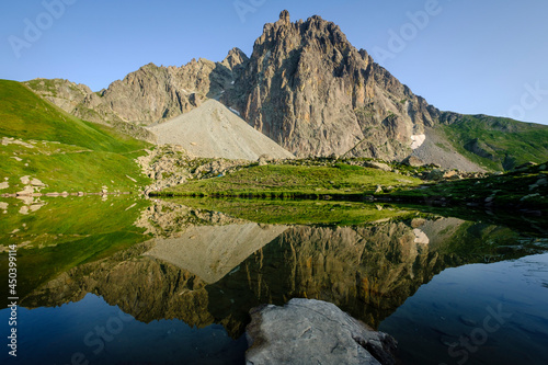 Midi d'Ossau peak, 2884 meters, and Pombie lake, Pyrenees National Park, Pyrenees Atlantiques, France photo
