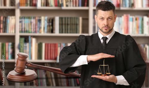 Male judge with scales of j...