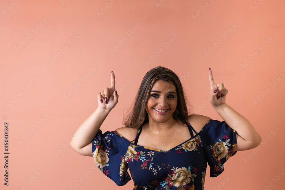 Latin white woman pointing her finger up Latin white woman pointing her finger up