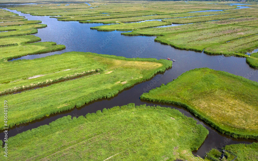 Drone Aerial view of  over Historic dutch Waterland landscape in may, the ilperveld near Den Ilp and Landsmeer the  Netherlands