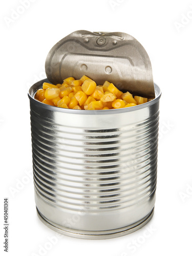 Opened tin can of corn kernels on white background