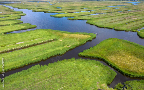 Drone Aerial view of  over Historic dutch Waterland landscape in may, the ilperveld near Den Ilp and Landsmeer the  Netherlands
