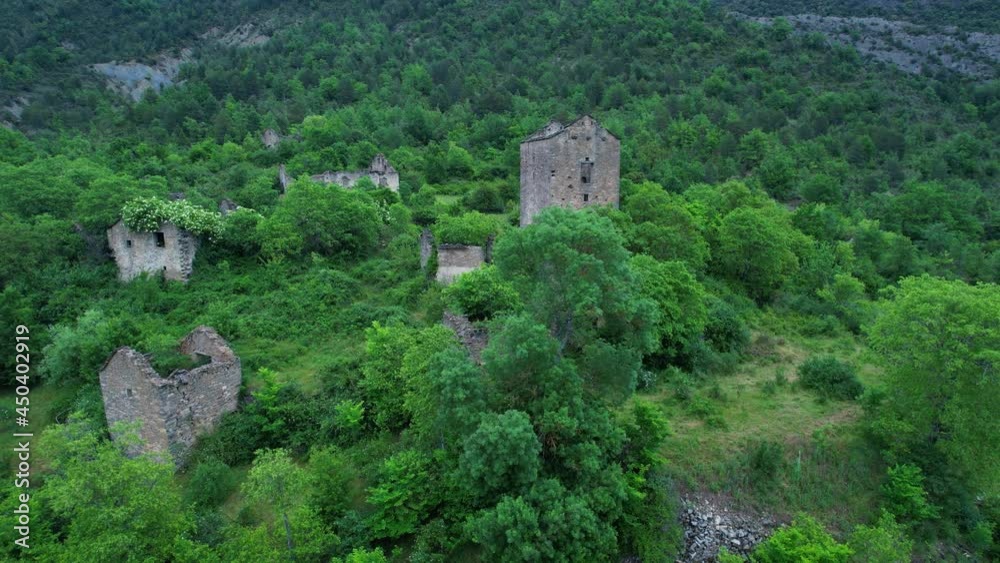 Aerial view in spring of the abandoned village near Janovas. In the Ara River Valley. Sobrarbe region, Huesca, Aragon, Spain, Europe. Aerial view in spring of the abandoned village near Janovas. In the Ara River Valley. Sobrarbe region, Huesca, Aragon, Spain, Europe.