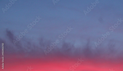 Blue Sky at Sunrise with Pink Cloud