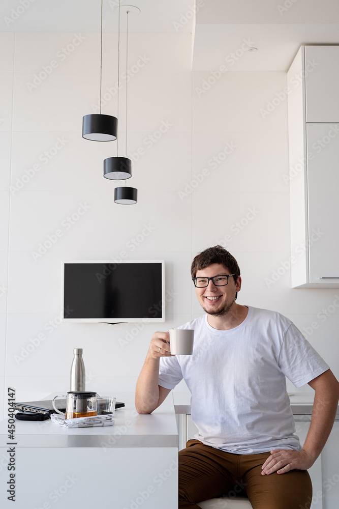 Young happy man Enjoying Breakfast At Home, thinking Young happy man Enjoying Breakfast At Home, thinking