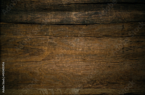 The texture of old mahogany with horizontal cracks in a vintage style.