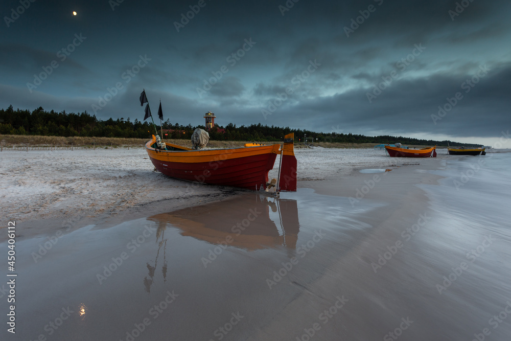 Fototapeta premium A fishing wooden boat moored by the beach, Debki, Poland.