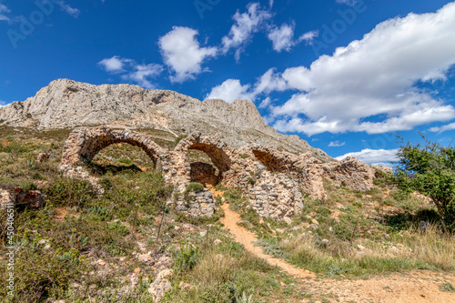ruins of a castle in the mountain of bernia located in the valencian community, alicante, spain photo