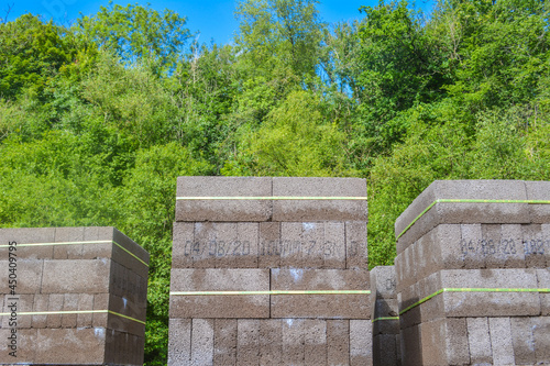 Stacks of grey concrete  blocks on a building site