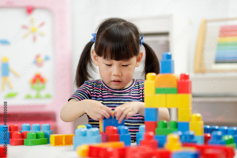 young girl playing creative toy blocks for homeschooling young girl playing creative toy blocks for homeschooling