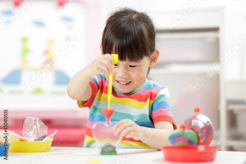 young girl making sand crafts for homeschooling