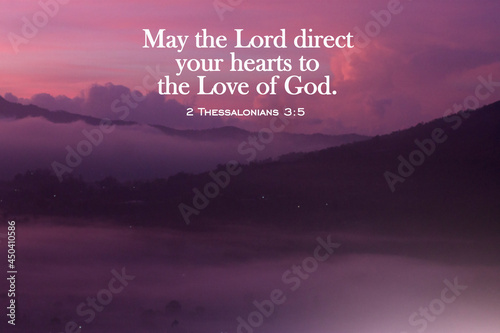 Bible verse quote - May the Lord direct your hearts to the Love of God. 2 Thessalonians 3:5 On pink purple nature background of misty morning in the mountains at sunrise. Prayer with faith to God. photo