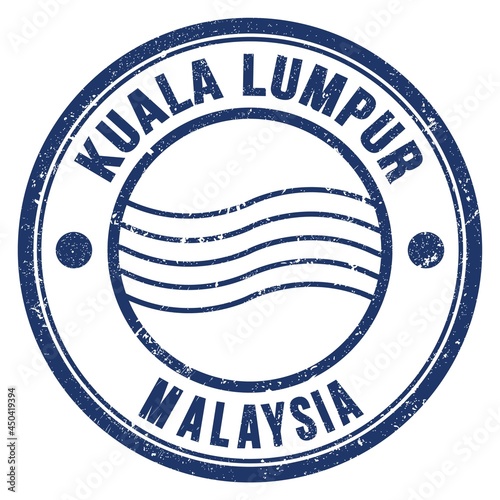 Photography KUALA LUMPUR - MALAYSIA, words written on blue postal stamp