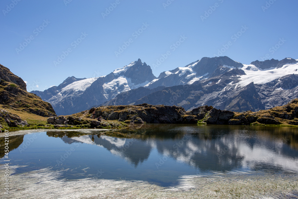 Reflection of the Mountain La Meije on the Lac Lérié in the French Alps 