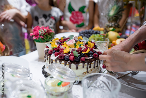 Festive cake with chocolate and fruits. Black forest cake. High quality photo.