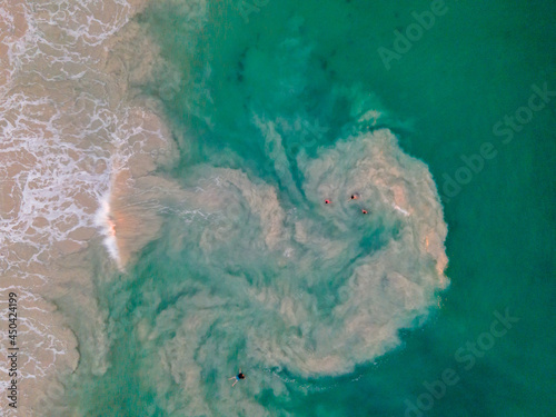 Fototapeta Naklejka Na Ścianę i Meble -  Surfers in a riptide