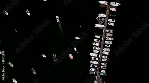 Birds eye aerial drone shot over Hingham Harbor Docks and Boats , Static drone footage. photo