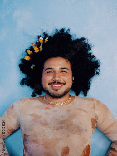 Man with butterflies in his hair 