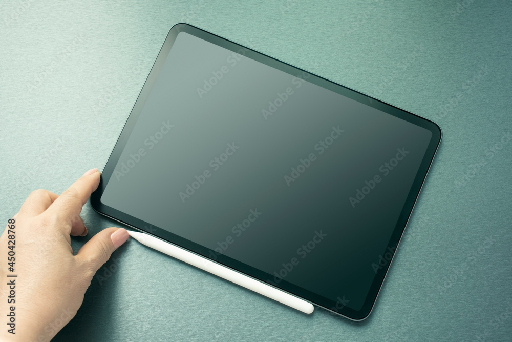 Woman using tablet pc with digitized pen.closeup Woman using tablet pc with digitized pen.closeup
