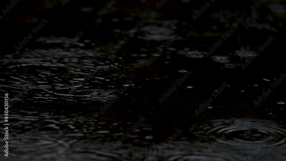 Video of ripples spreading on the surface of raining water Video of ripples spreading on the surface of raining water