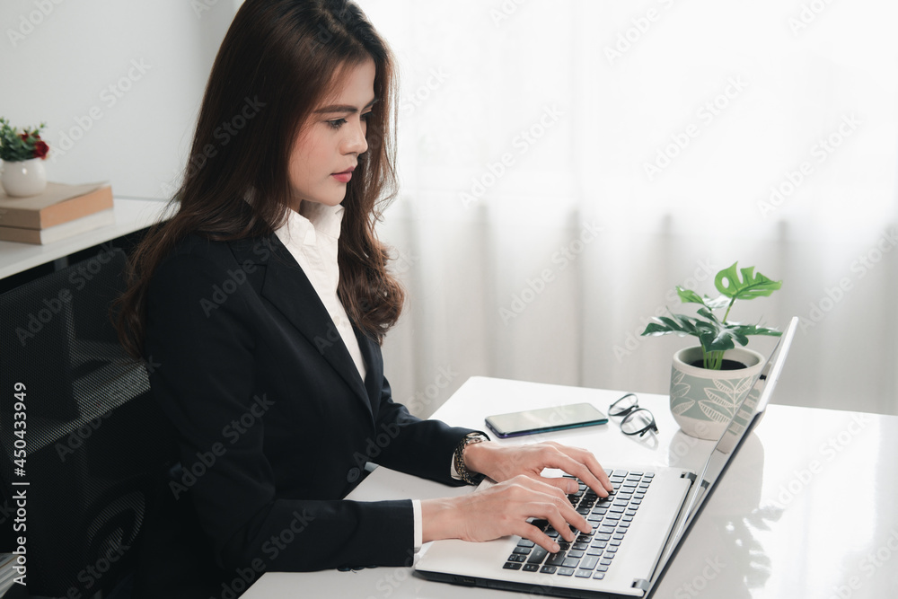 Women use laptop working in office workplace Women use laptop working in office workplace