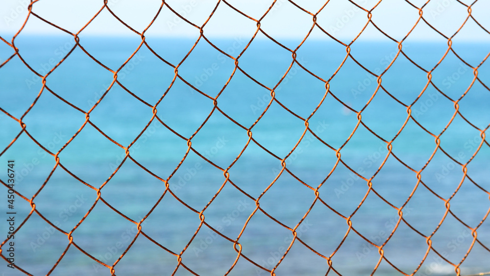 Fototapeta premium link fence against blue sky