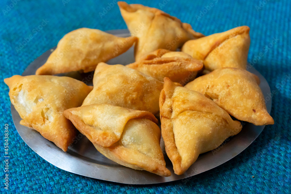 Homemade Samosa, samsa or smosa. A vegetarian spicy Indian special traditional street food. Iftaari dish, Selective focus. Homemade Samosa, samsa or smosa. A vegetarian spicy Indian special traditional street food. Iftaari dish, Selective focus.