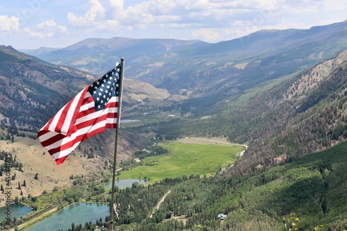 Photography american flag in the mountains