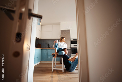 Couple in love spending morning time on bright kitchen © WellStock