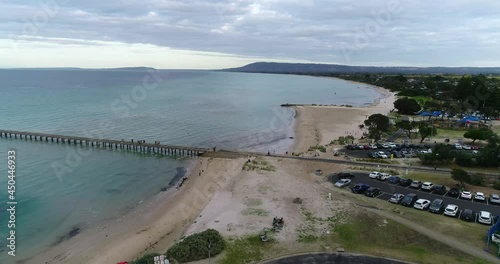 Drone overlooking beach foreshore and car park pier dusk dolly forward Rye Mornington Peninsula photo
