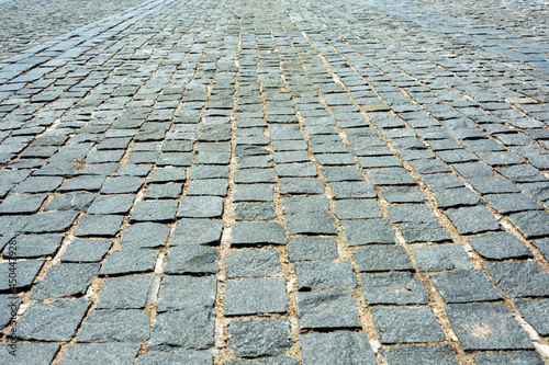 gray old cobblestone pavement, paved squares, flat stones