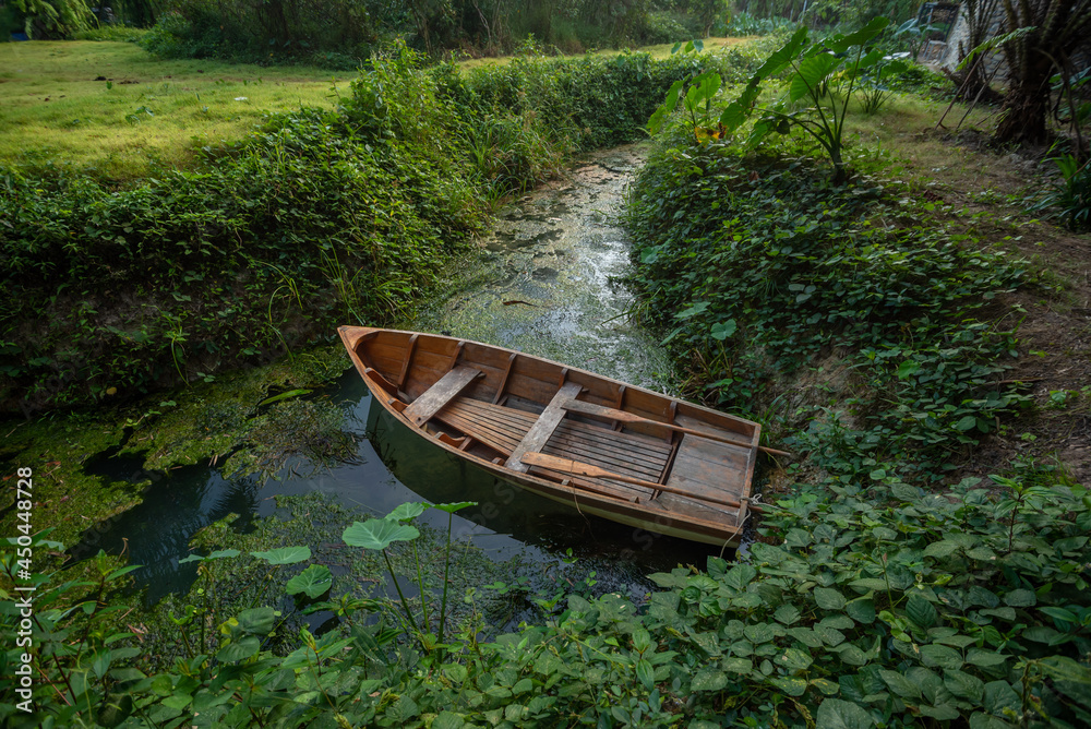 Wooden rowboat on the banks of the river Wooden rowboat on the banks of the river