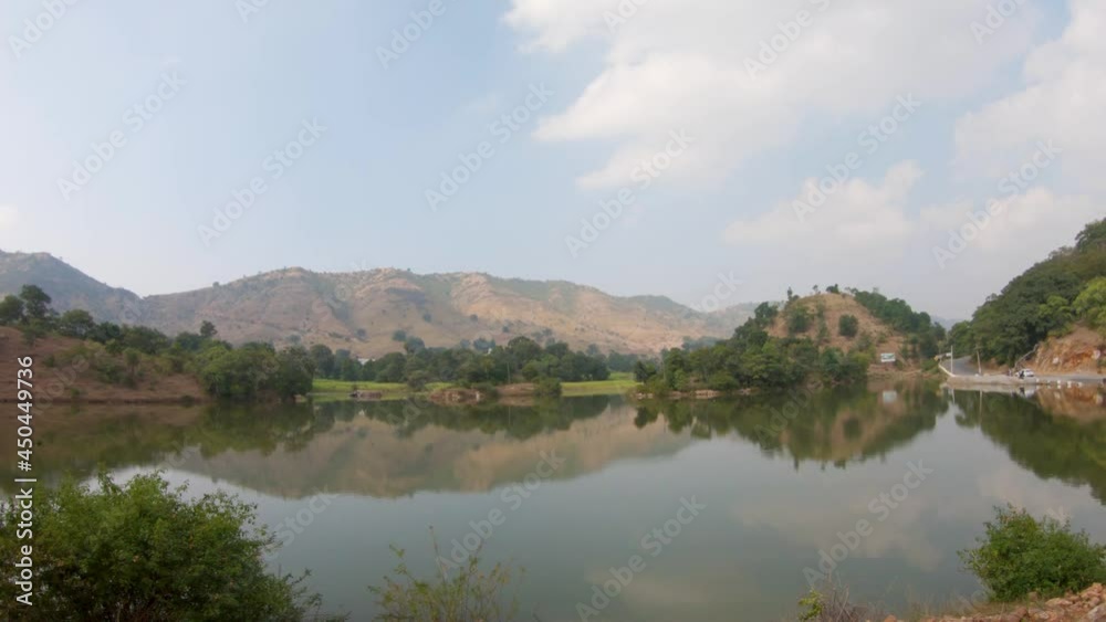 Reflection of the hill on the water of the pond at Kumbhalgarh in Rajasthan, India Reflection of the hill on the water of the pond at Kumbhalgarh in Rajasthan, India