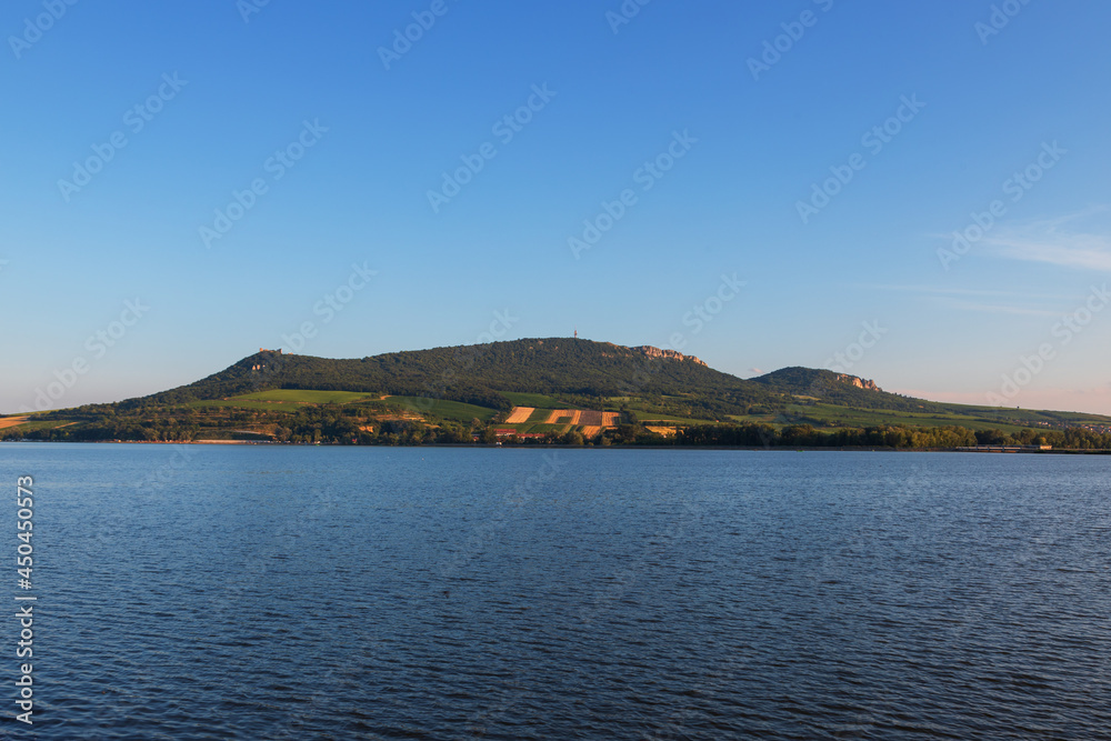 View of Lake Musov and Palava in the Czech Republic. In the background a television transmitter and the ruins of the castle Devicky.