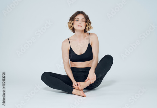 woman in sports uniform yoga balance isolated background