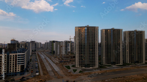 City block. Multi-storey buildings. City landscape at sunrise. Aerial photography.