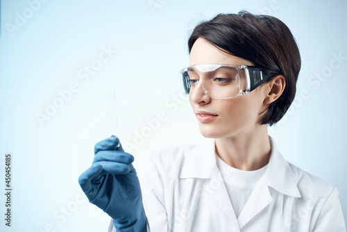 female laboratory assistant blue gloves research technology Science professional