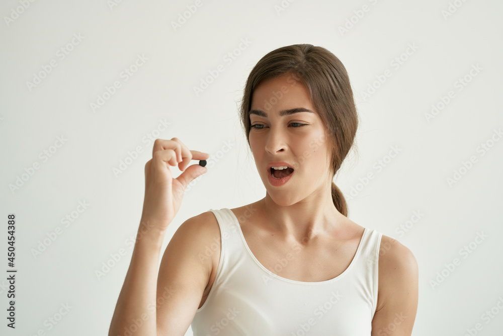 woman with bandaged hand medicines in hands health emotions woman with bandaged hand medicines in hands health emotions