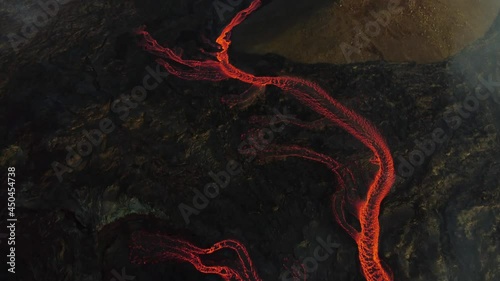 Incredible aerial of the dramatic volcanic eruption of the Fagradalsfjall (Geldingadalur) volcano in Reykjanes peninsula Iceland. Flowing lava. Close look. Drone footage. photo