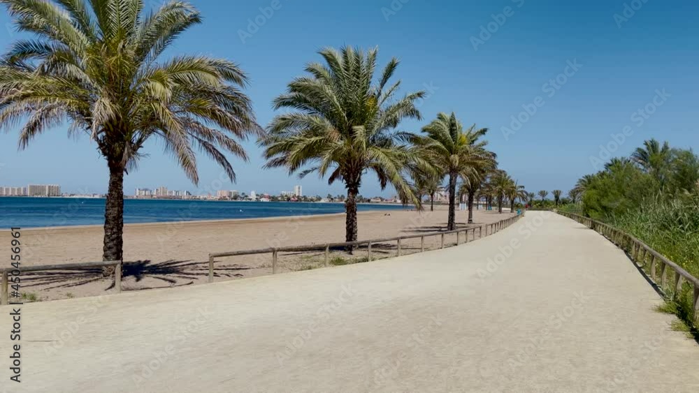 La Manga del Mar Menor in Murcia Spain Mediterranean Sea beach calm waters without people passing transparent waters sunny day La Manga del Mar Menor in Murcia Spain Mediterranean Sea beach calm waters without people passing transparent waters sunny day